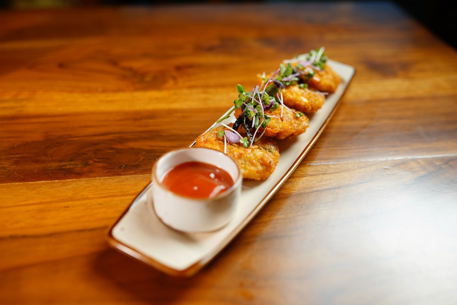 Small plates of starters on a wooden table