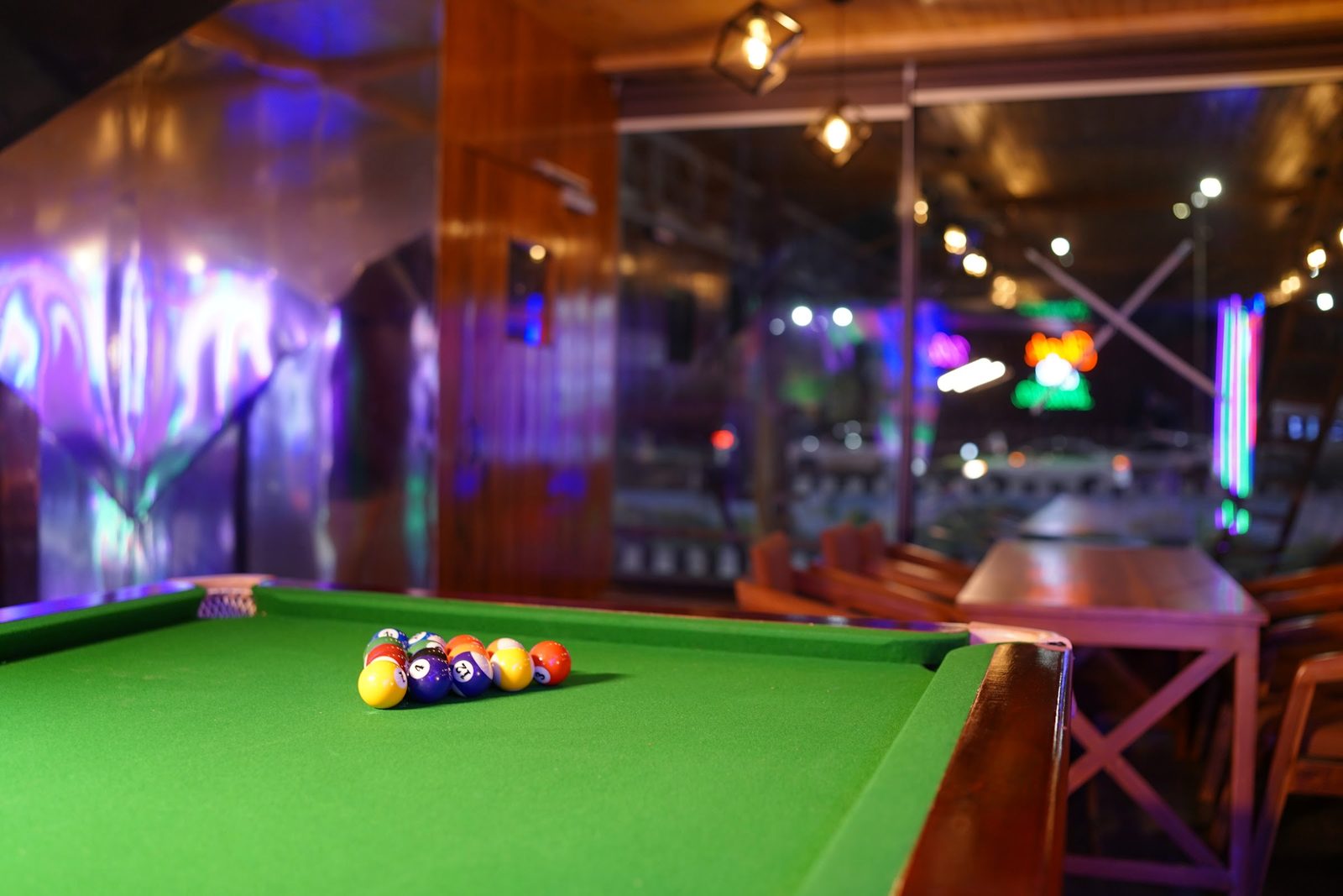 Pool table under warm lights