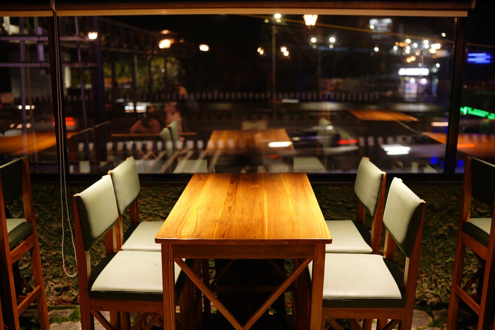Long tables set for a group under warm lights